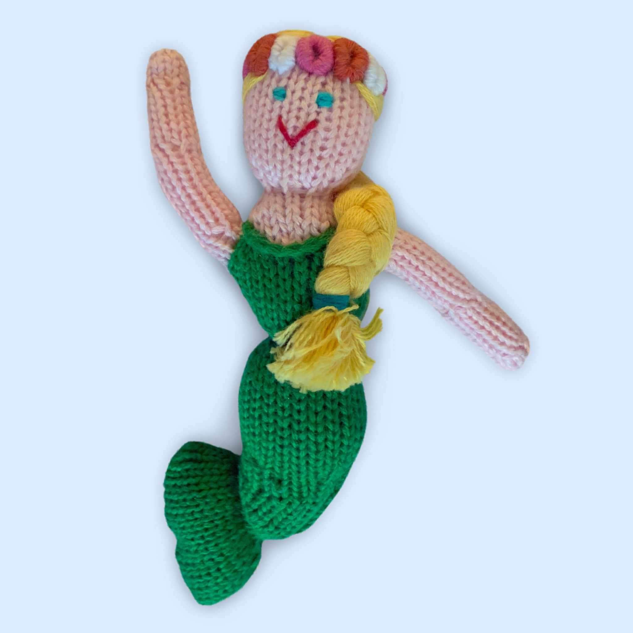 Estella Animal Rattle Toy For Babies, Showing Knit Mermaid Rattle In Organic Cotton On Blue Background