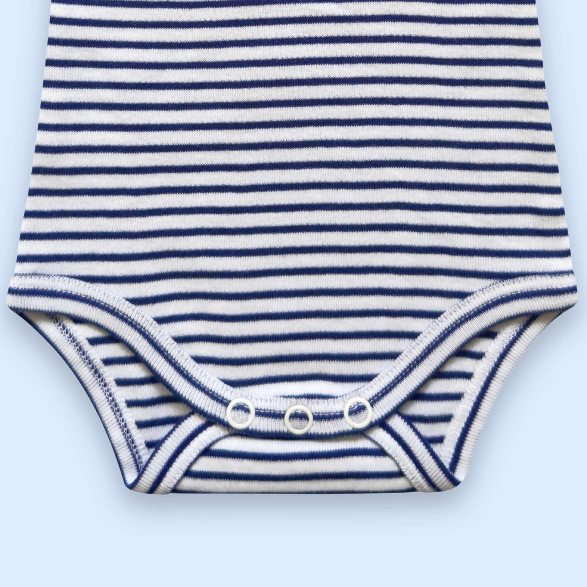 Estella Baby Clothing Organic La Mer Whale Embroidered Bodysuit. Detail showing the crotch with snap closure.