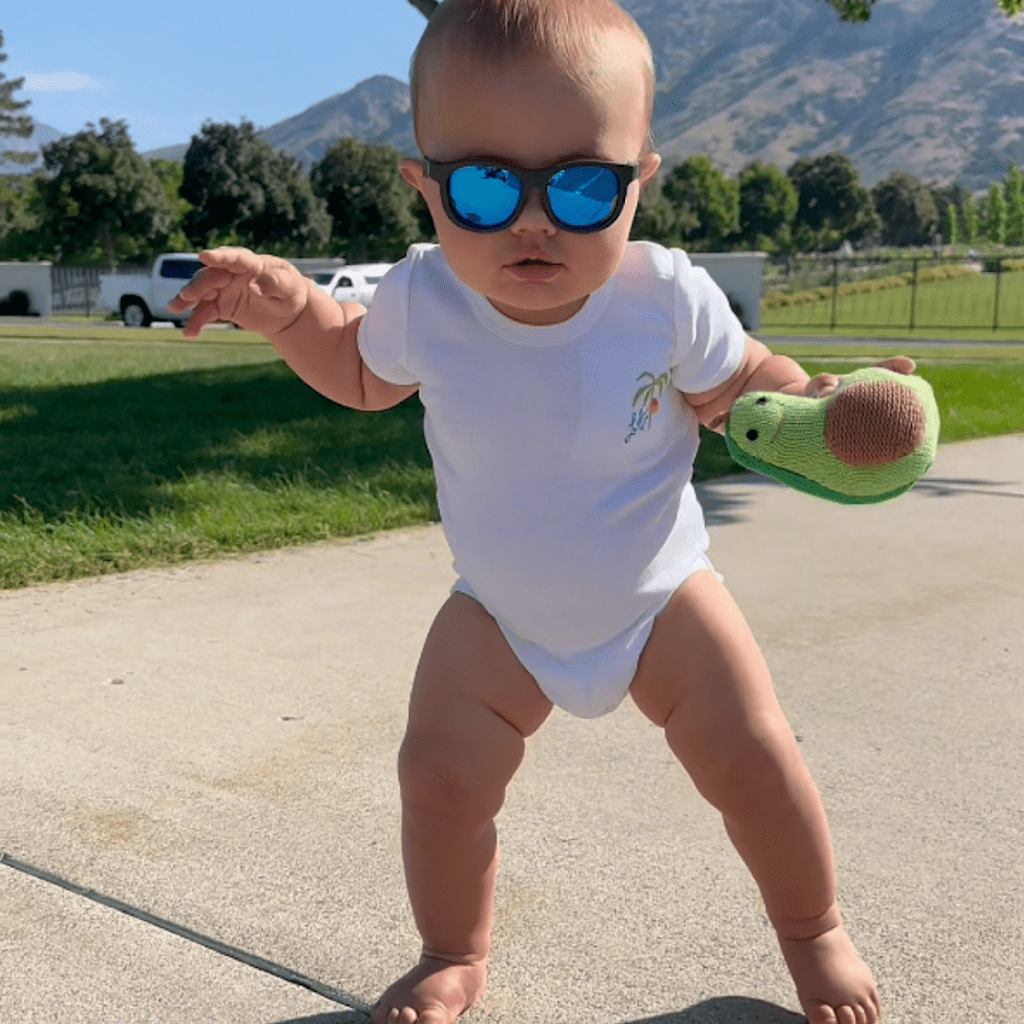 Estella Baby Gift Set, Organic Bodysuit, Bib, Swaddle, Book, Rattle Toys and Blue Sunglasses