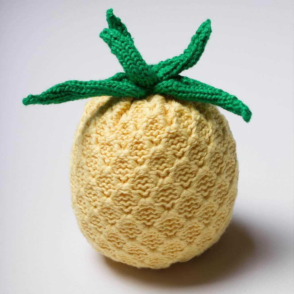 organic baby rattle knit pineapple toy. Yellow and green.