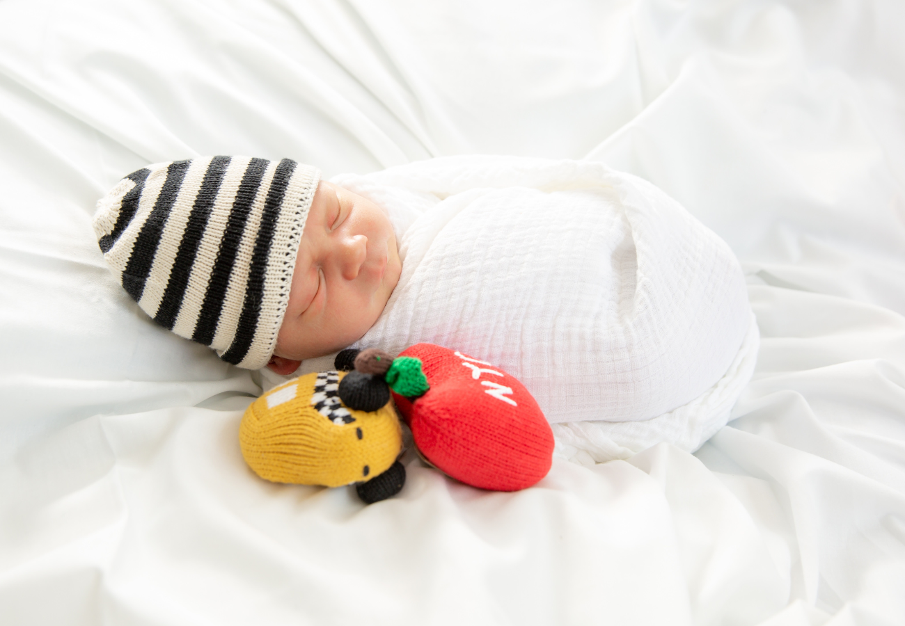 baby with baby shower gifts