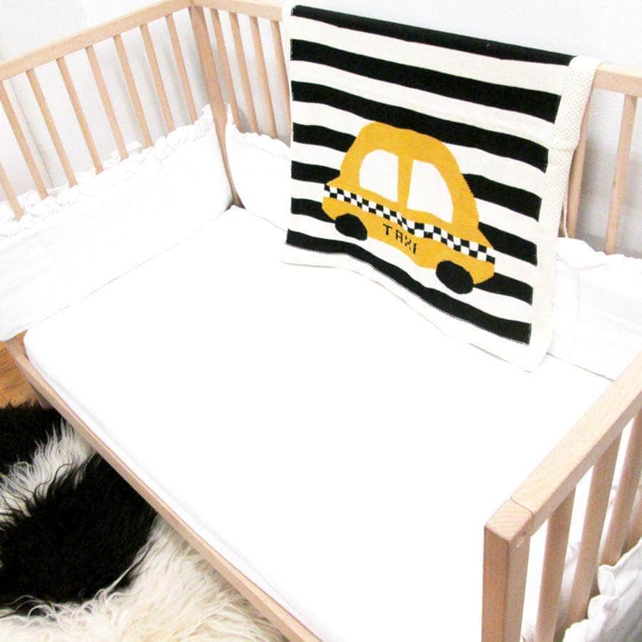 Black and white striped organic cotton baby blanket with a yellow NYC taxi — Estella