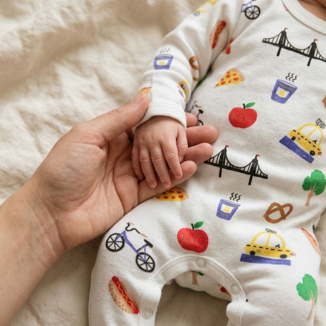 Organic cotton baby rompers and onesies handmade by Estella, perfect for newborn and infant everyday wear