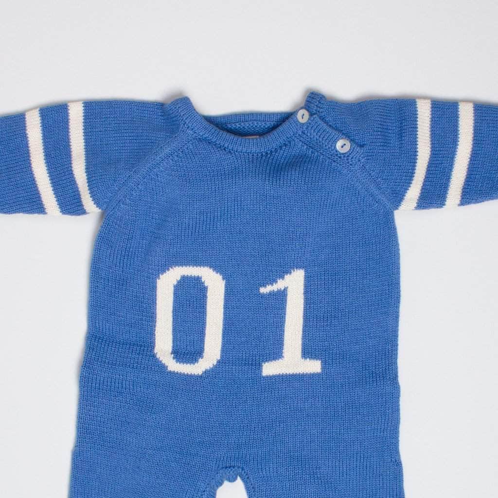 close up detail race car romper organic. Blue with number 1 in white.