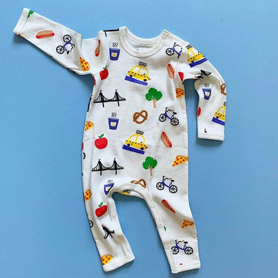 organic new york city print baby onesie. Print features apples, taxis, pretzels, hot dogs, pizzas, bridges, coffees, and bicycles.