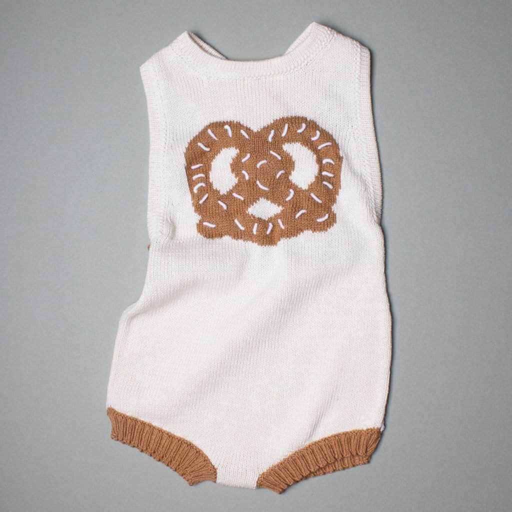 organic sleeveless romper pretzel graphic in the front. Brown and cream.