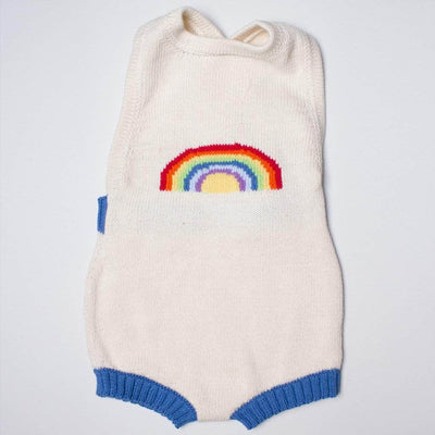 organic sleeveless rainbow romper. Rainbow graphic on the front and cream color with blue.