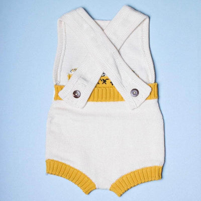 back of the organic sleeveless taxi romper. yellow and cream. 