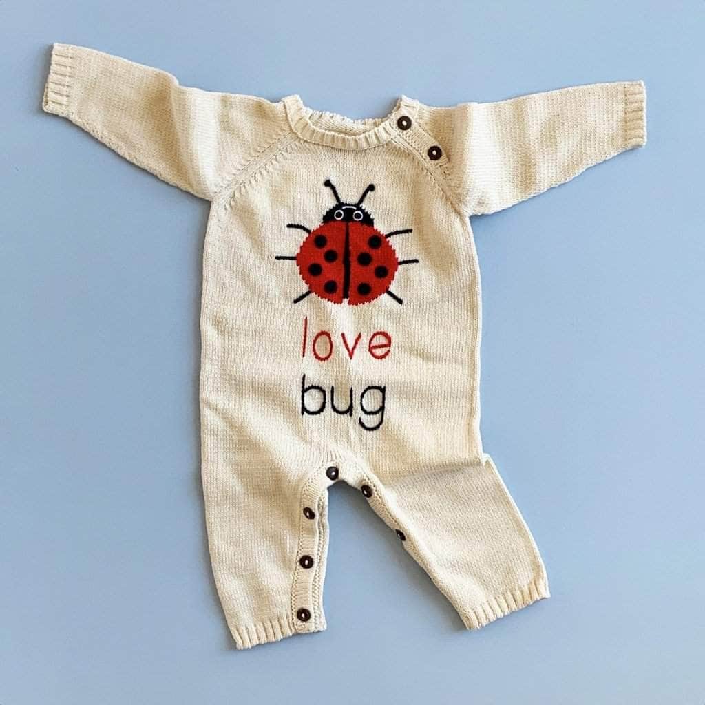 organic love bug romper with lady bug in the front with red and black letters.
