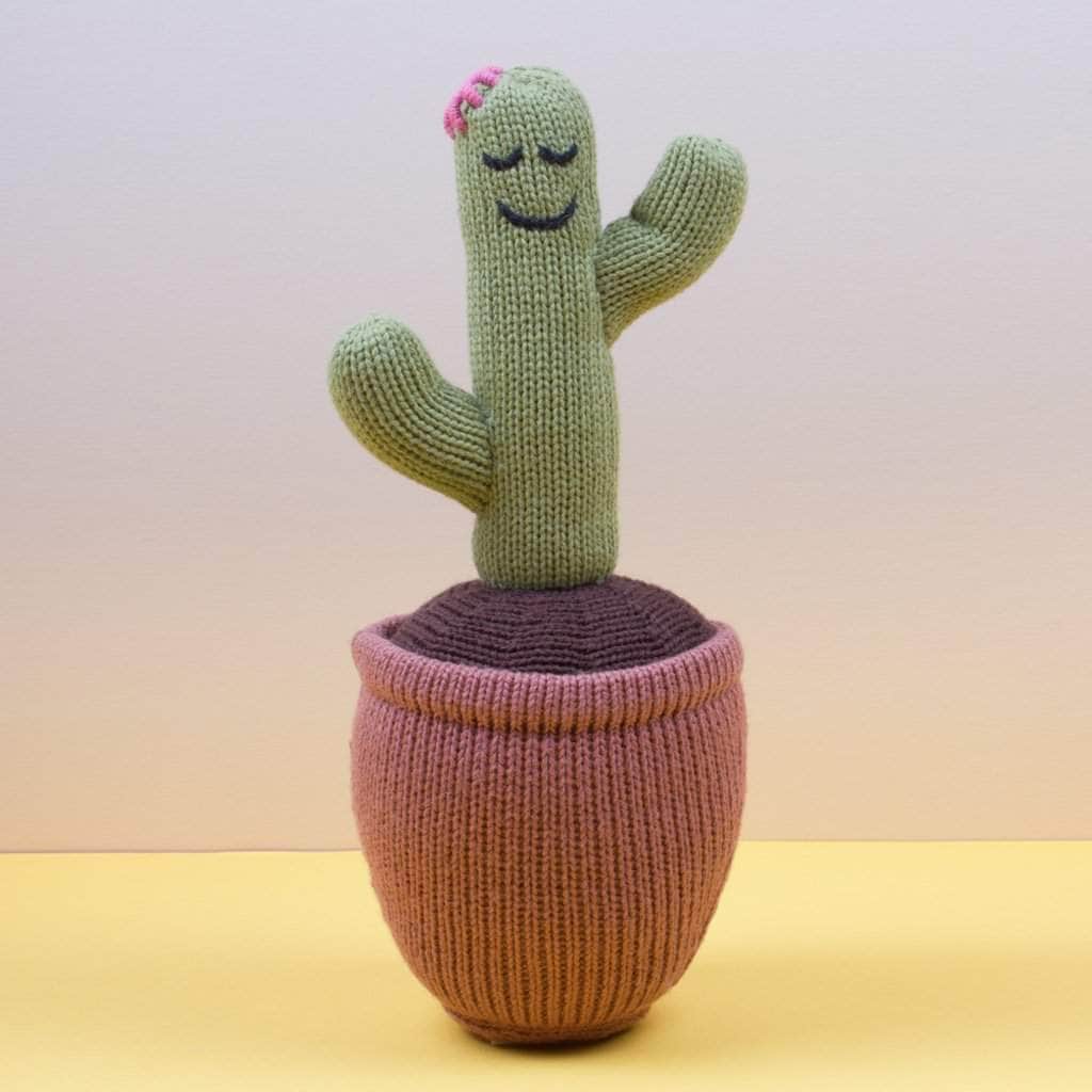 organic cactus stuff toy. Green, brown, dark brown, pink.