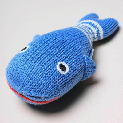 organic baby rattle whale toy. Blue. white stripes, red lips, black and white eyes.