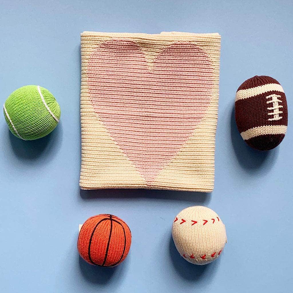 newborn sport lover gift pink set organic knit. Pink heart blanket, tennis ball rattle, football rattle, basketball rattle, baseball rattle. 