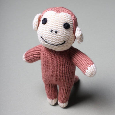 organic baby rattle monkey toy with brown and cream and black eyes.