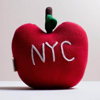 organic baby stuff toy apple. NYC written on it in white and red, brown and green.