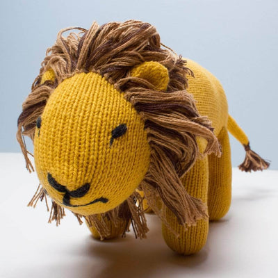 organic stuff toy lion. Brown, yellow, and black eyes. 