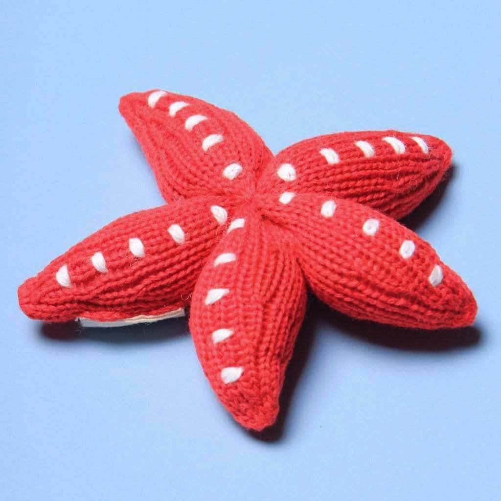 organic baby rattle starfish toy. red with white dots.