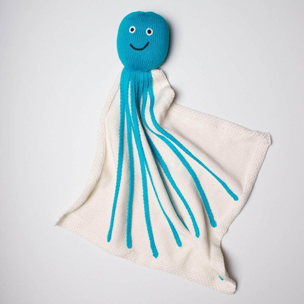 organic turquoise octopus blanket. Turquoise and cream color.