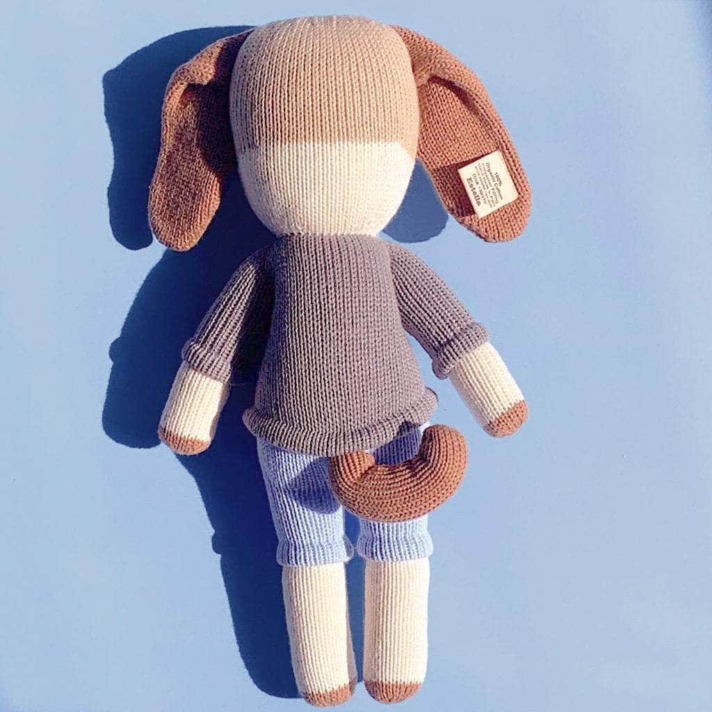 back of the Frank doll organic knitted brown, cream, grey, and blue.