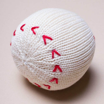 organic baseball rattle toy. White with red stitches.