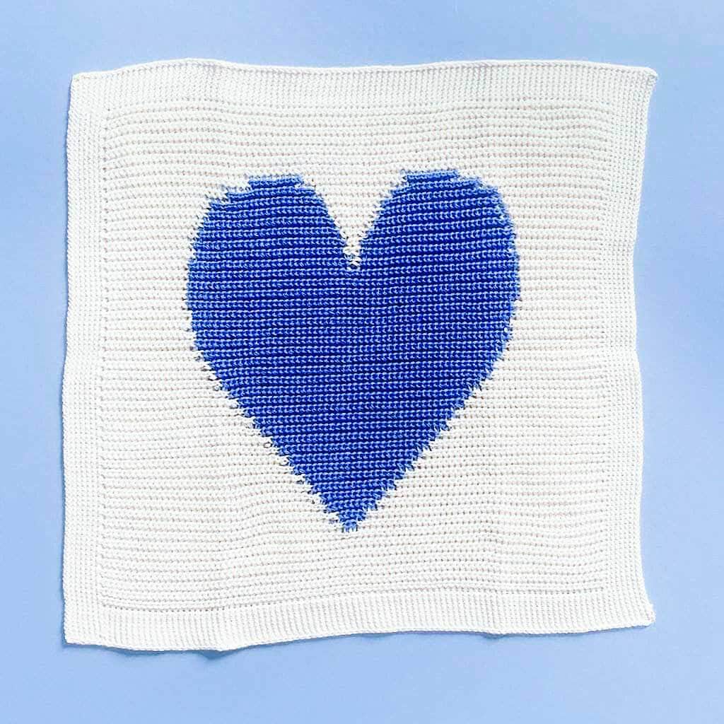 organic blue heart blanket. Blue heart and cream back ground.