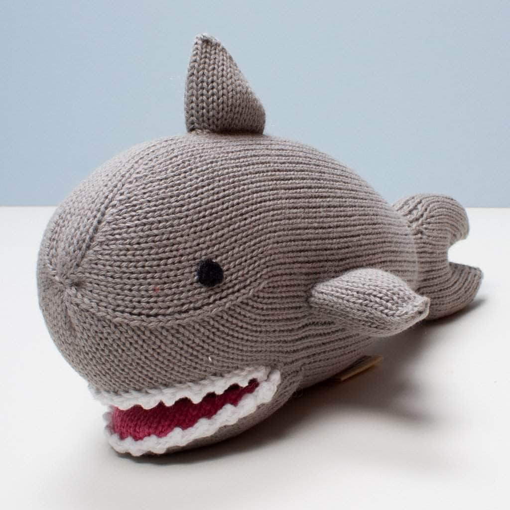 organic knit stuff toy shark. Grey, red tongue, white teeth and black eyes.