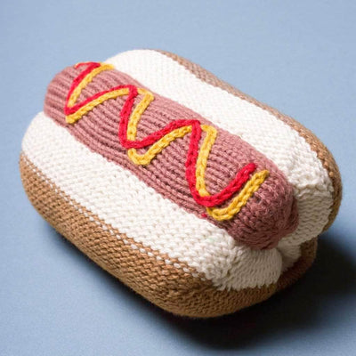 organic baby rattle hot dog toy. red, yellow, brown, cream, and pink. 