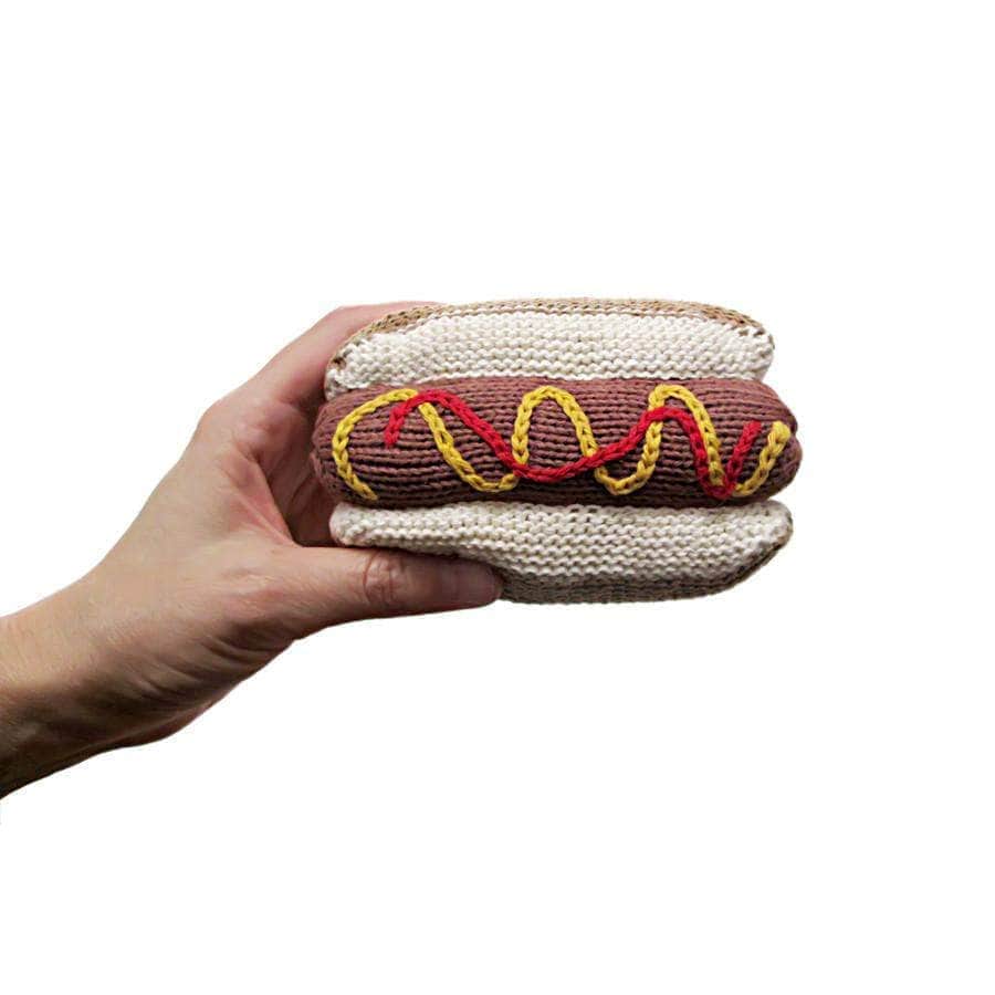 Infant Toy - Knit Rattle in Hot Dog Shape with Ketchup & Mustard Stitched in Model's Hand