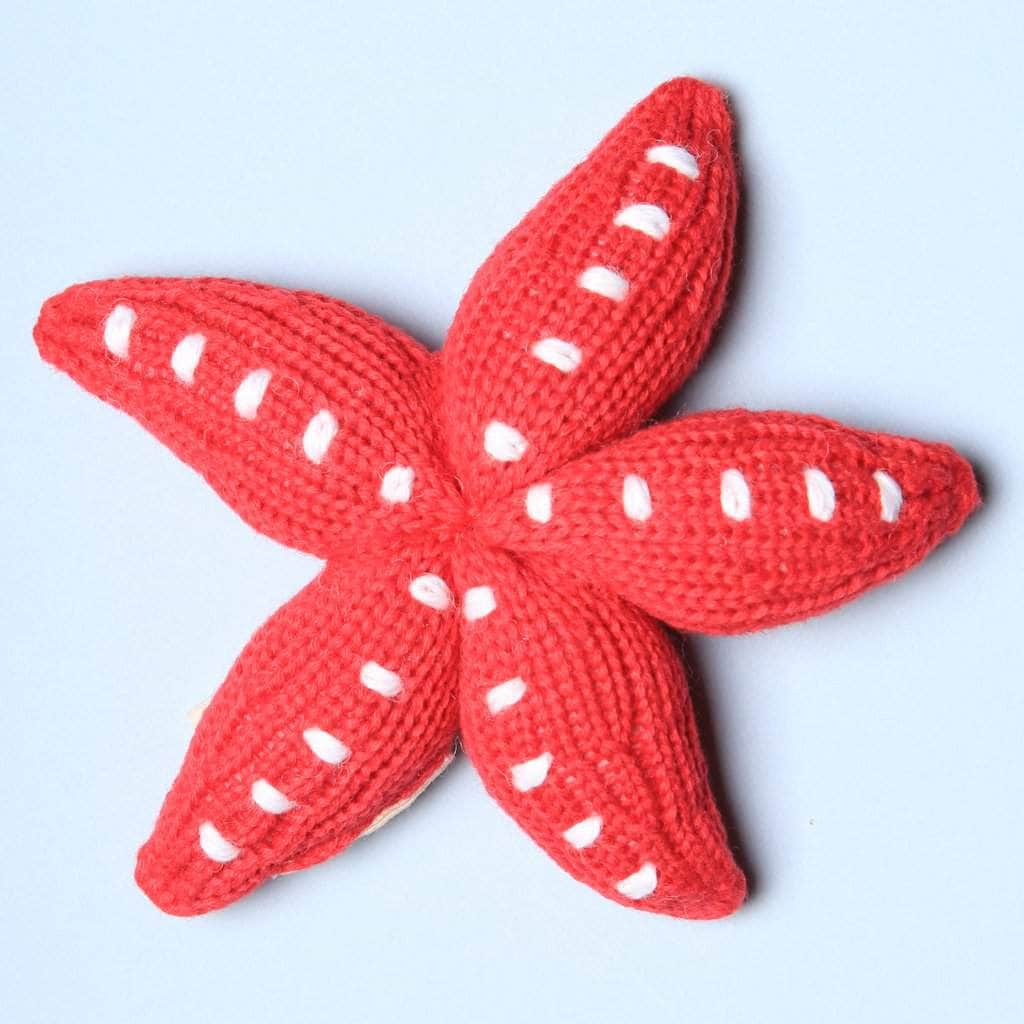 organic rattle knit toy starfish. Red and white.