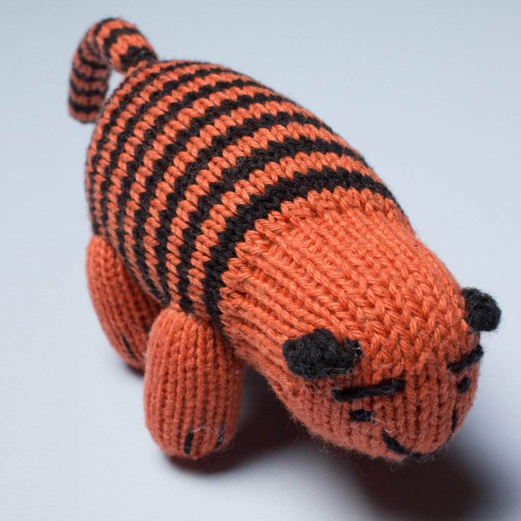 organic knit rattle toy tiger. Orange, and black.